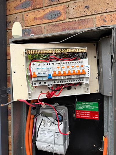 Upgraded home switchboard with new circuit breakers and solar isolation switch, installed by Helcro Electrical