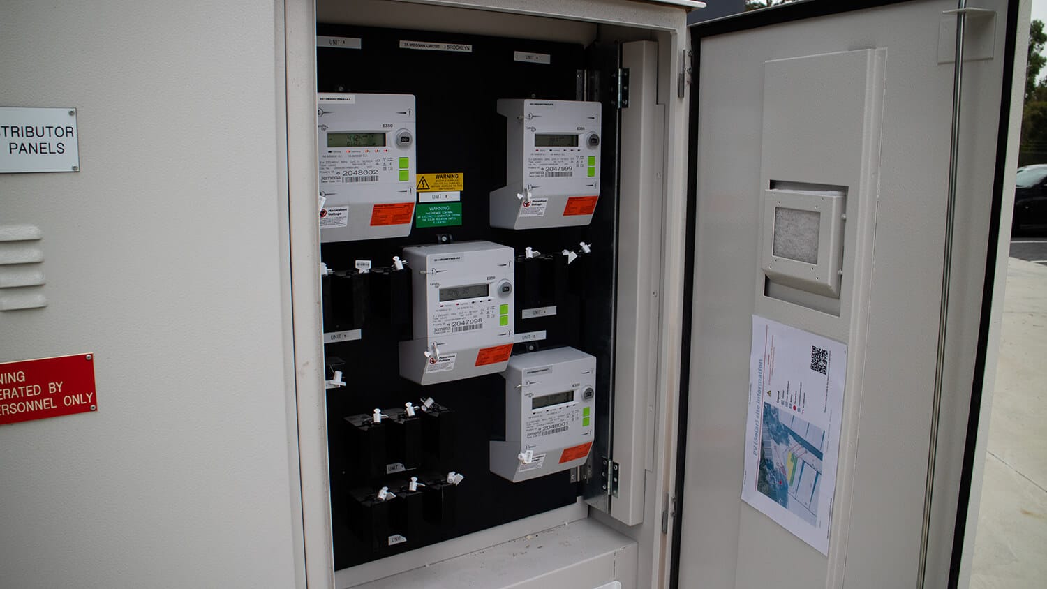 Open meter panel with multiple Landis+Gyr smart electricity meters